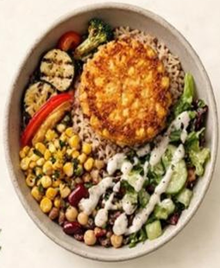 Crispy Corn Brown Rice & Veggies Bowl with brown rice, crispy corn patty, grilled veggies and pulses